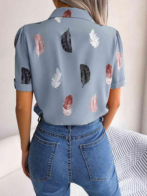 the back of a woman's shirt with leaves on it