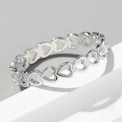 a silver bracelet with hearts on it