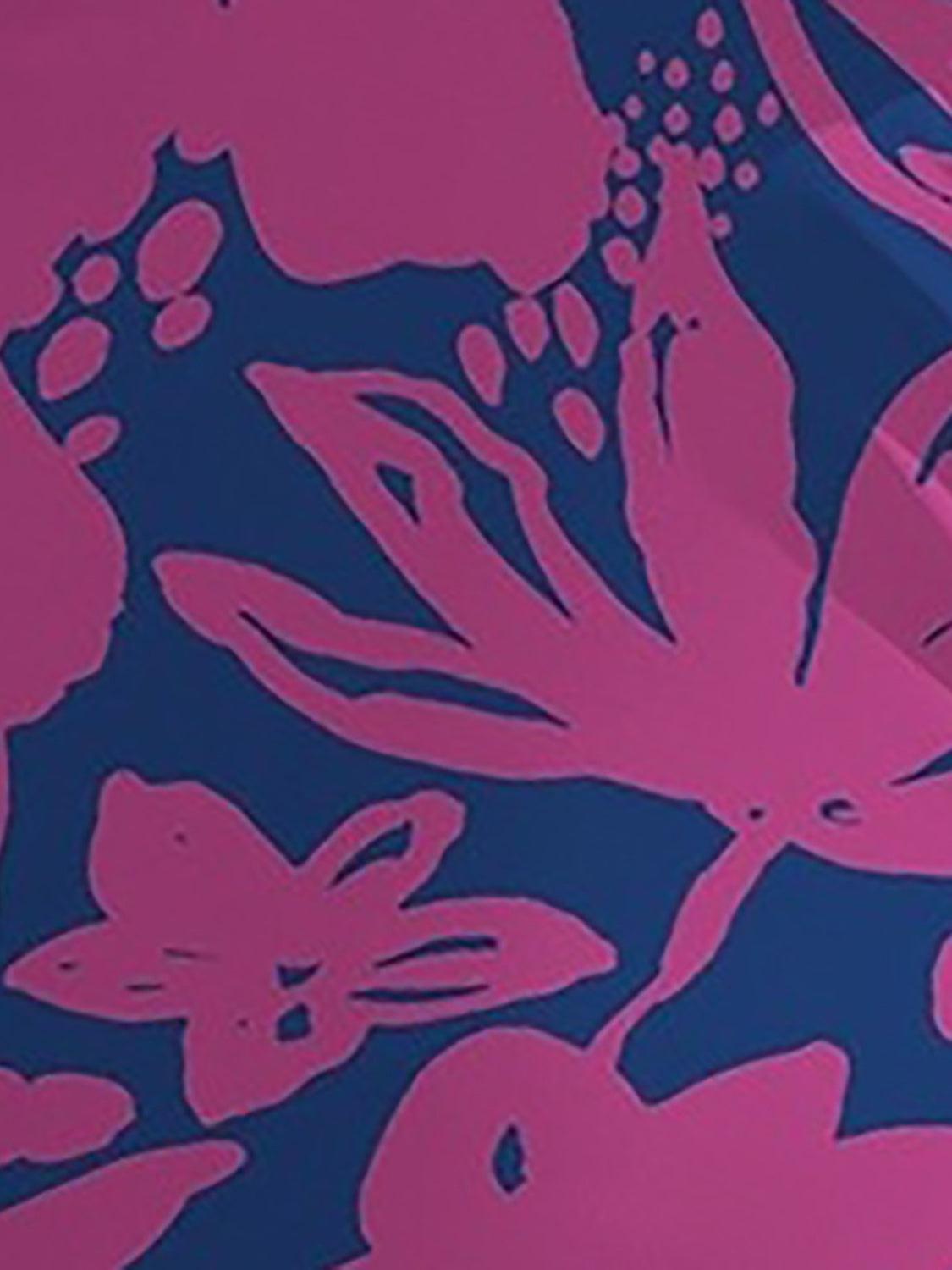 a close up of a pink and blue wallpaper