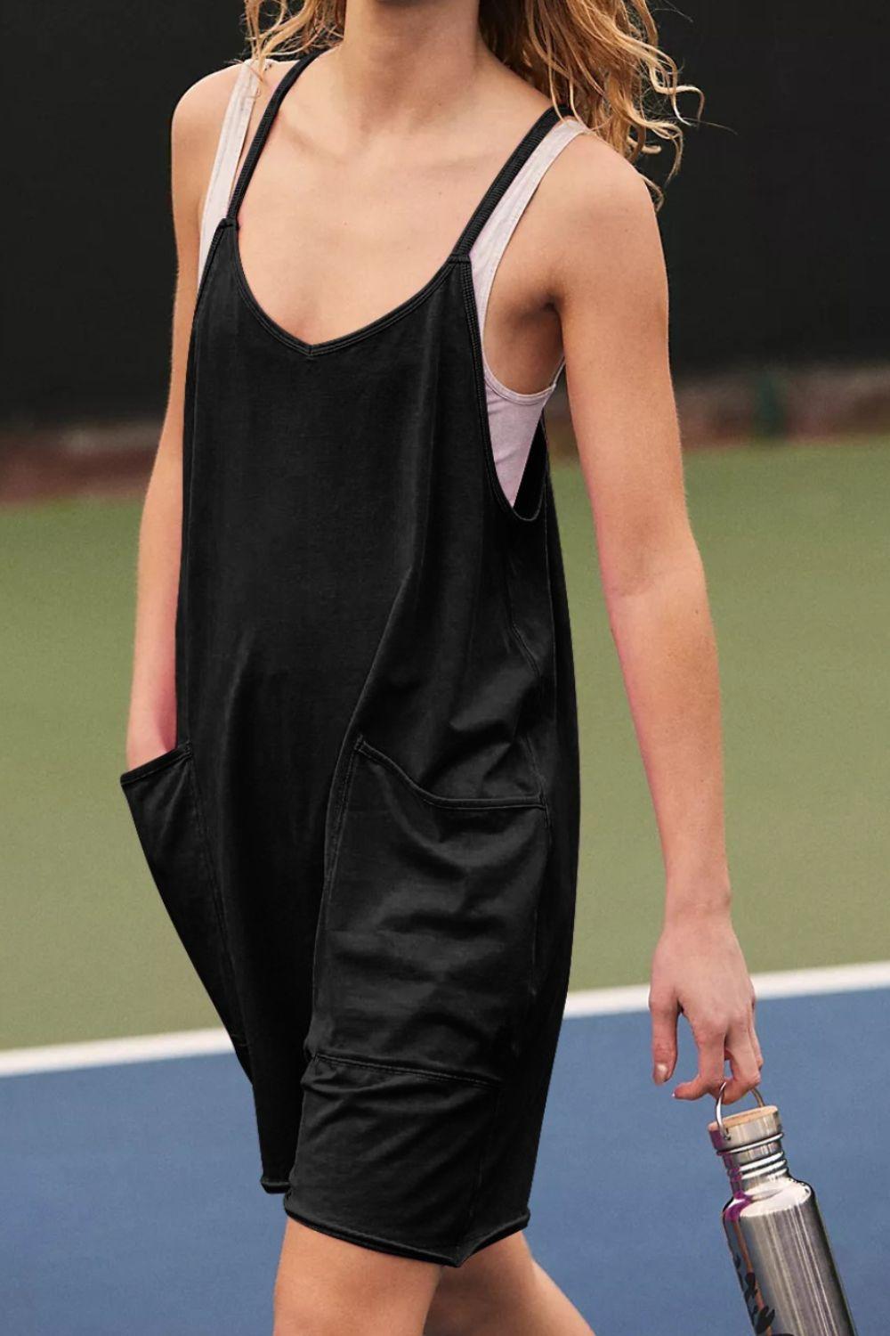 a woman holding a tennis racquet on a tennis court