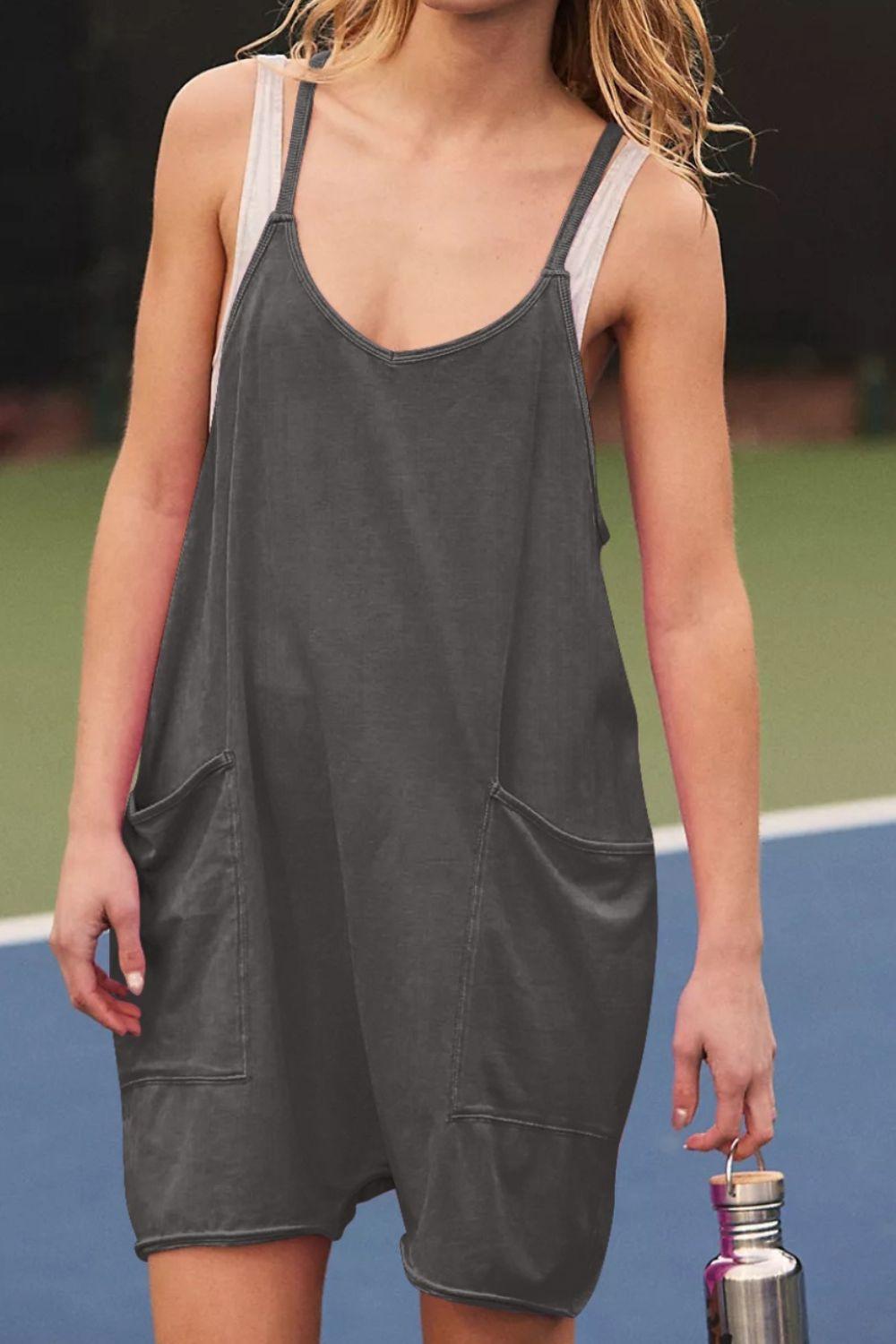 a woman holding a tennis racquet on a tennis court