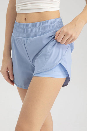 a close up of a person wearing a short skirt