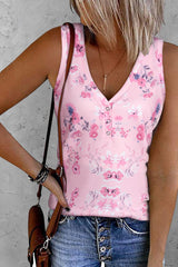 a woman wearing a pink top and jeans