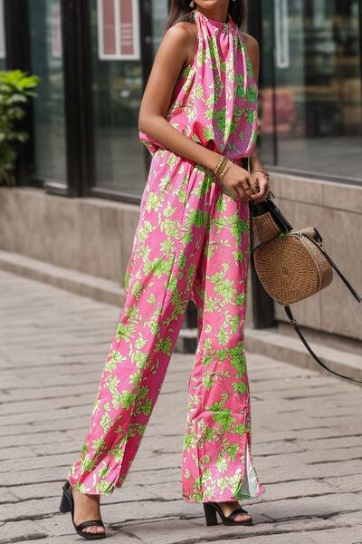 a woman wearing a pink and green jumpsuit