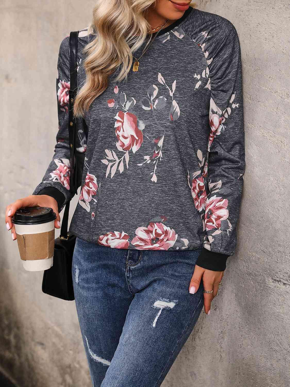 a woman leaning against a wall with a cup of coffee