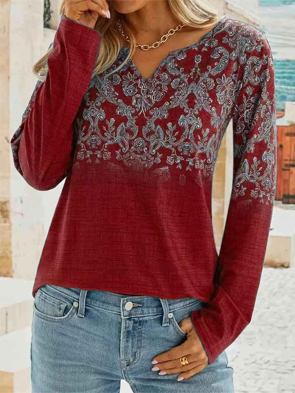 a woman wearing a red top and jeans