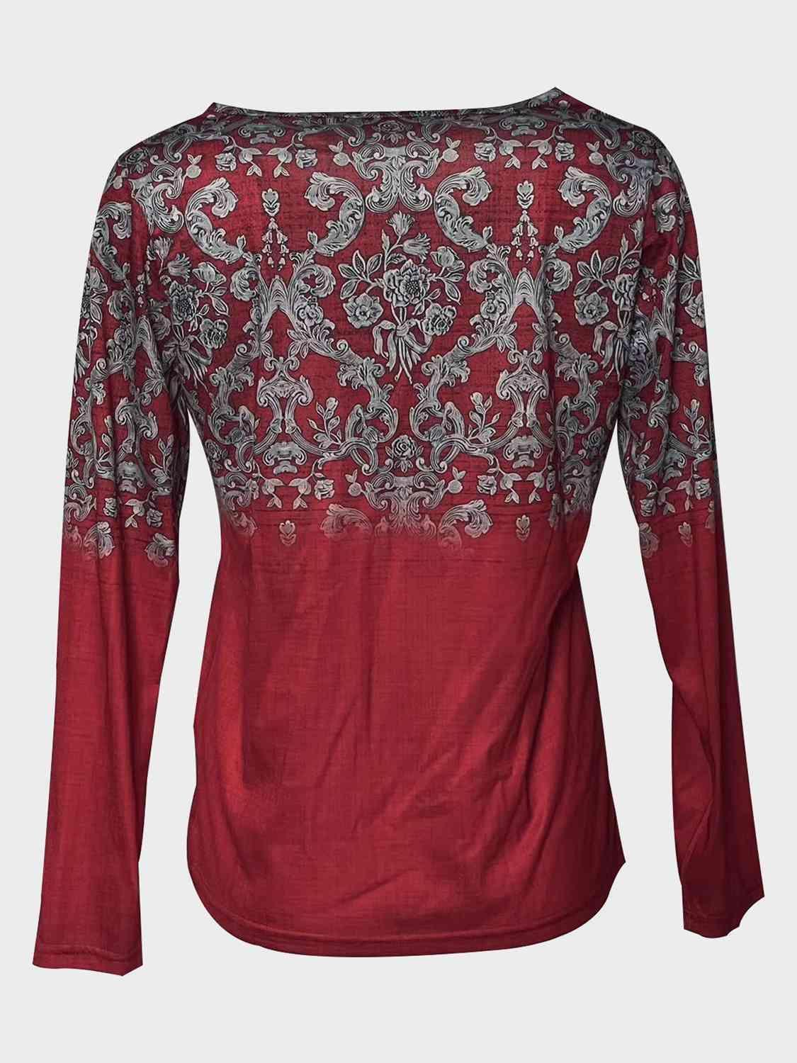 a red top with a floral design on it