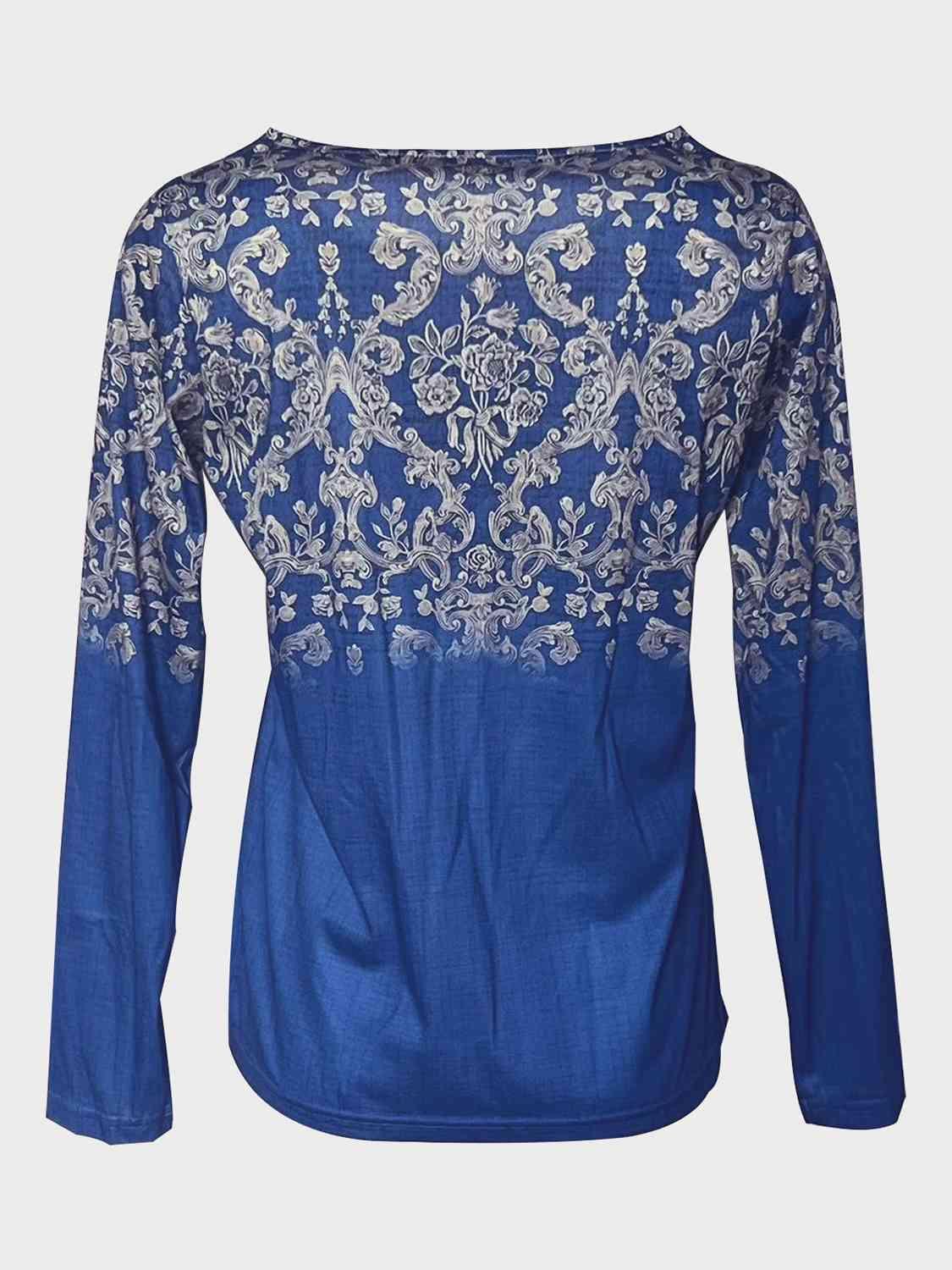 a blue top with white flowers on it