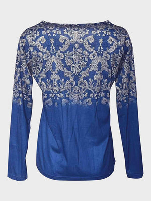 a blue top with white flowers on it