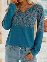 a woman wearing a blue top and jeans