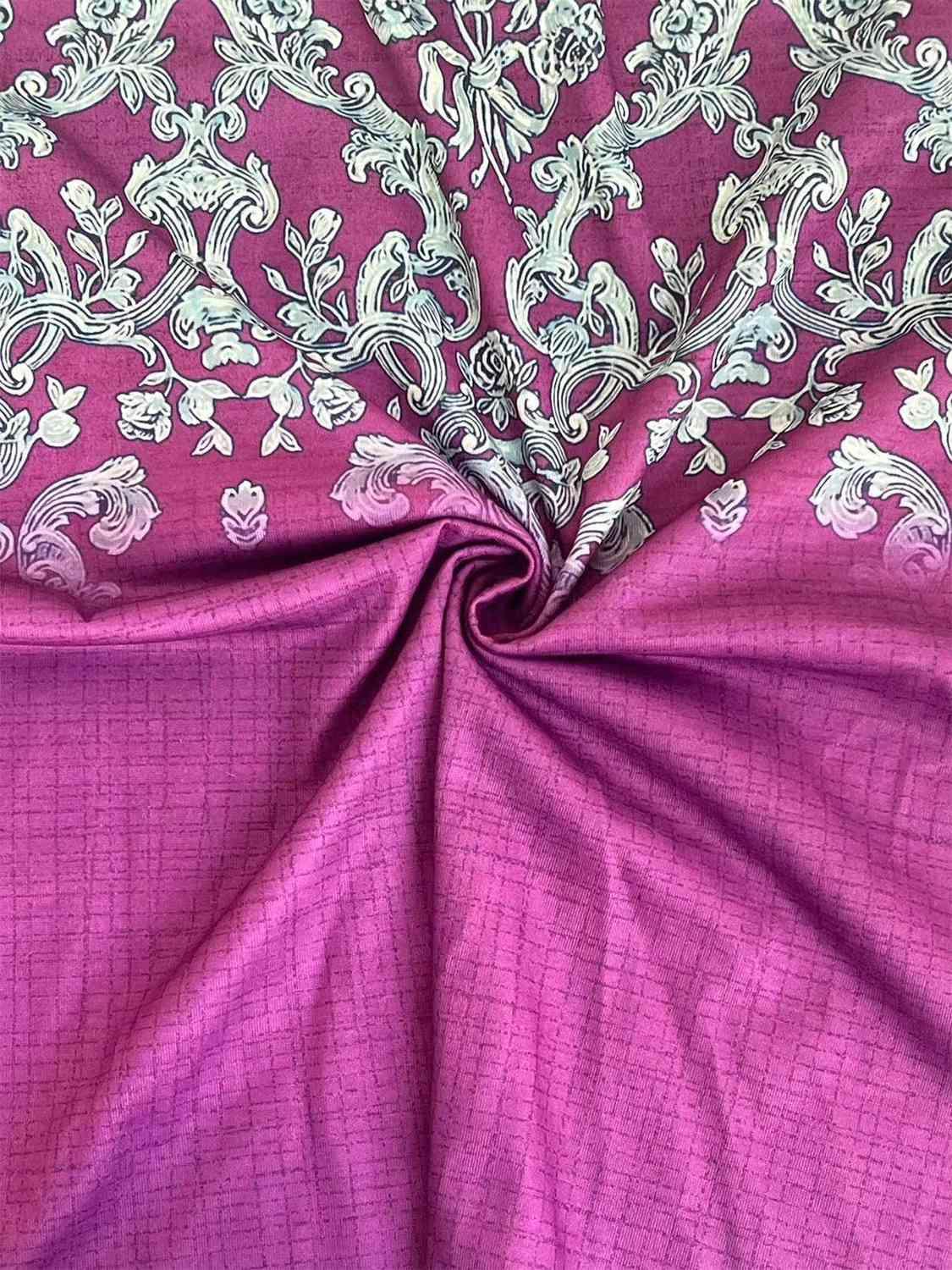 a close up of a purple and white fabric