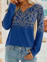 a woman wearing a blue top and jeans