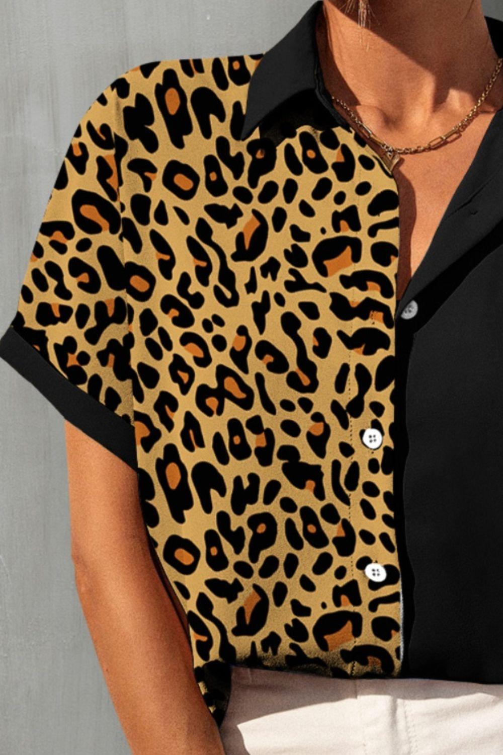 a woman wearing a leopard print shirt and white pants