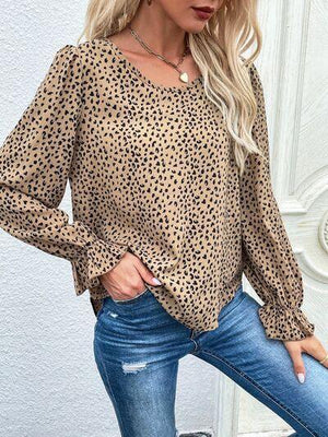 a woman wearing a leopard print top