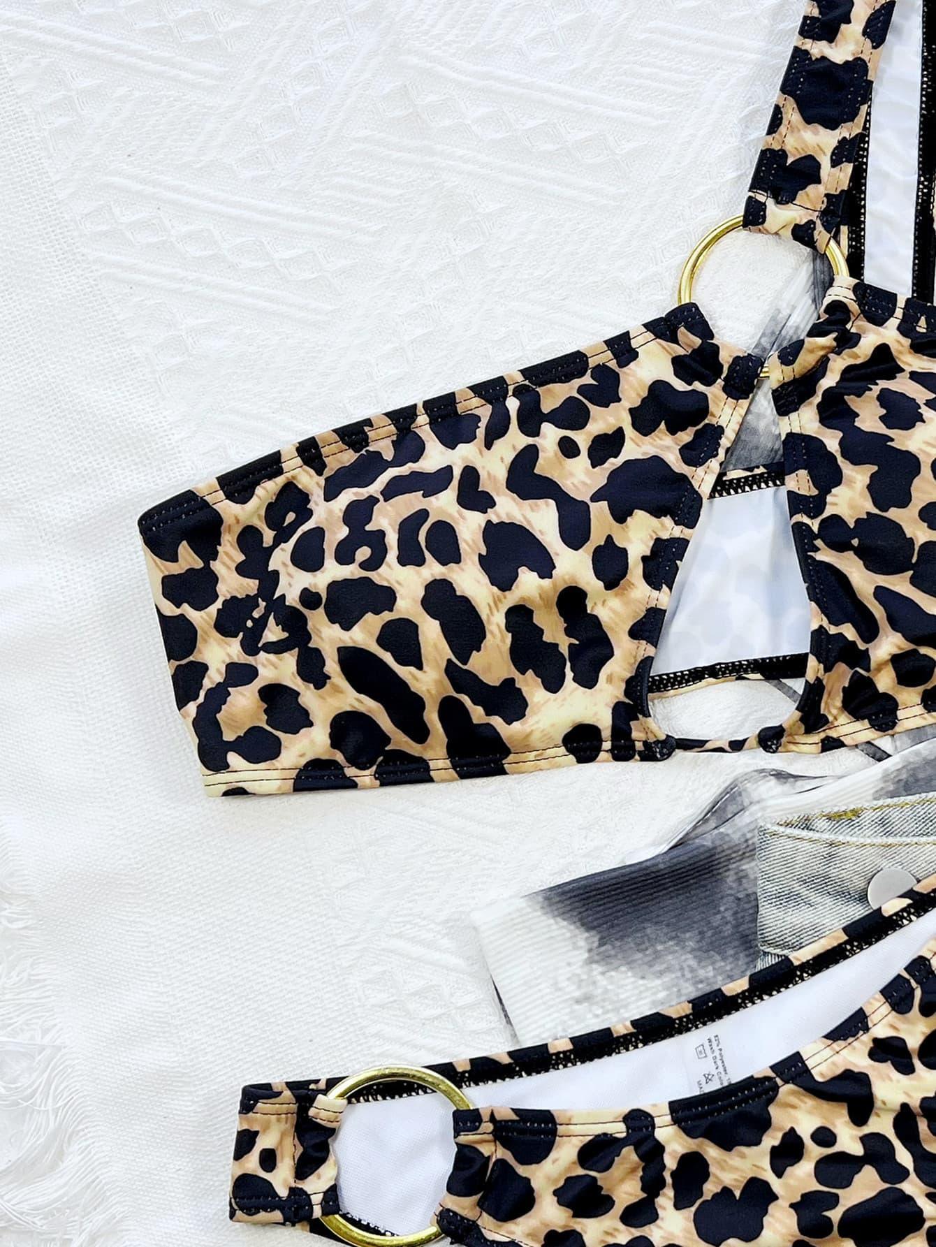 a pair of leopard print bras on a bed