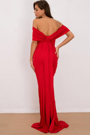 a woman in a red dress with a backless top