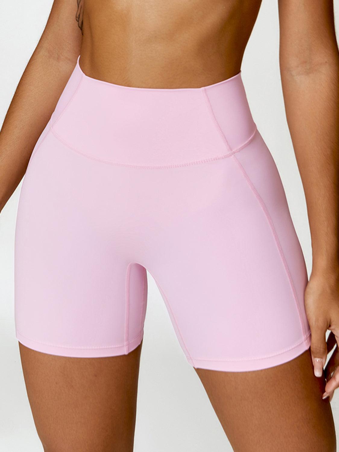 a close up of a person wearing a pink shorts
