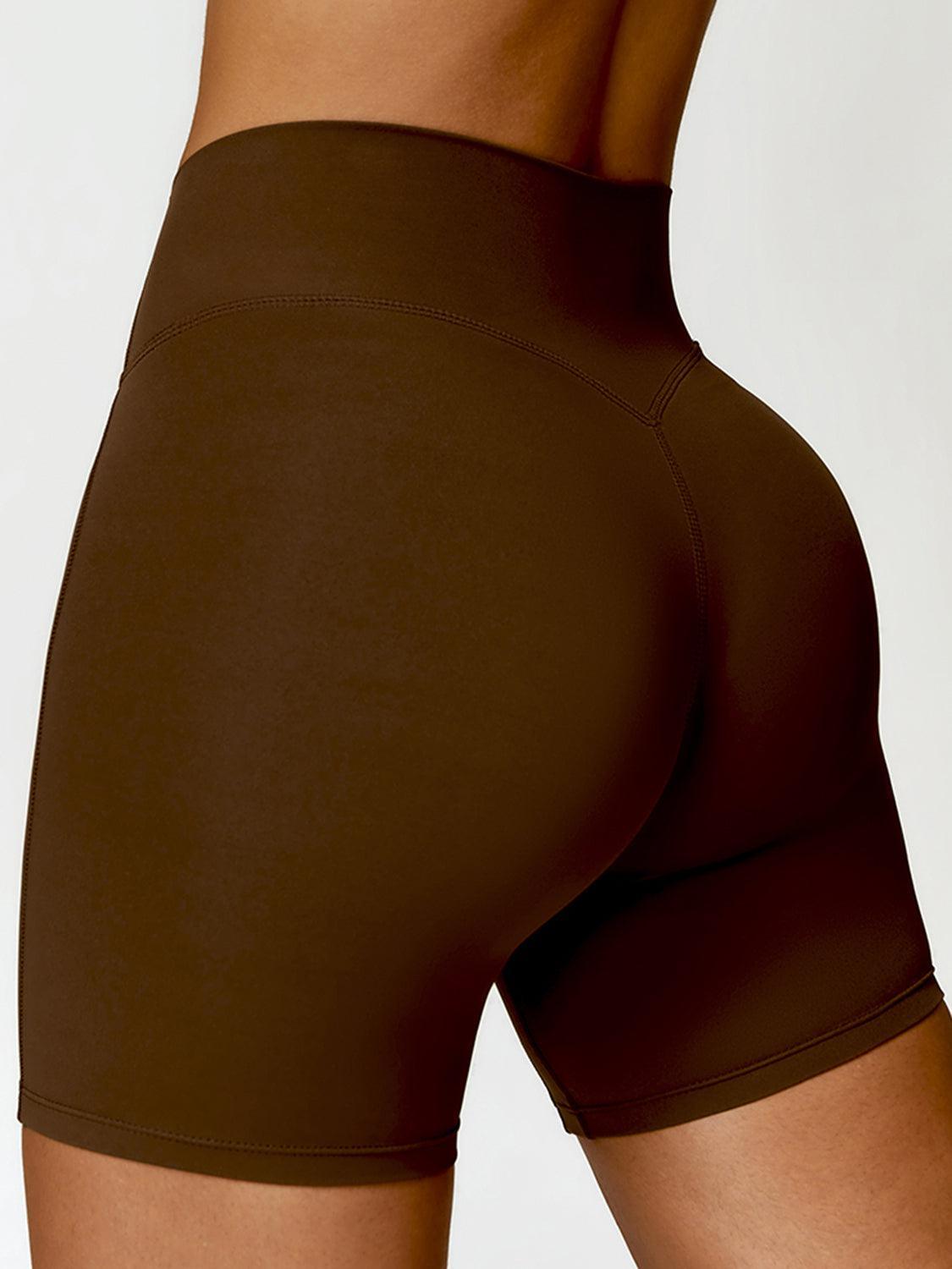 a close up of a woman's butt in a brown shorts