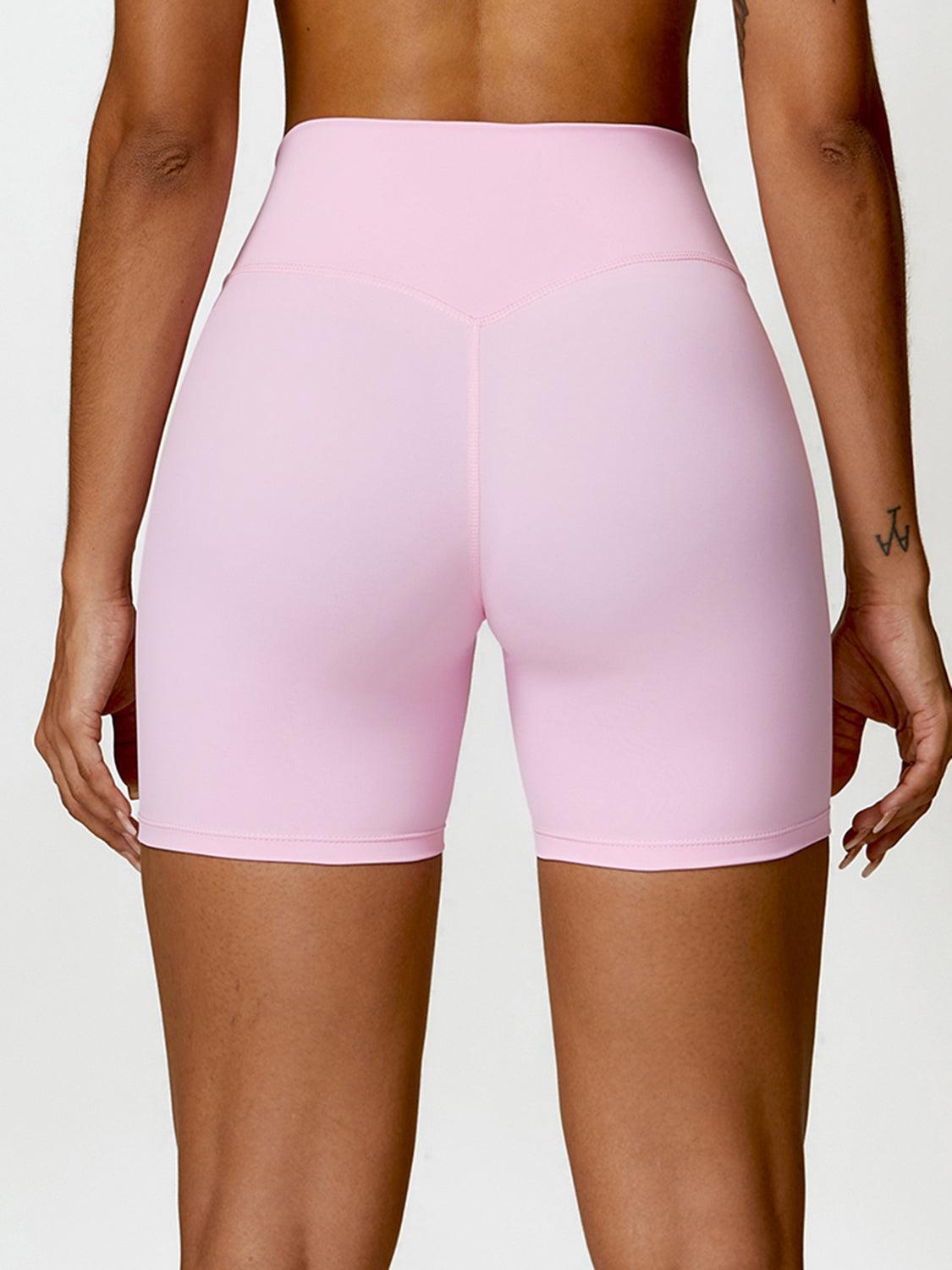 the back of a woman in pink shorts