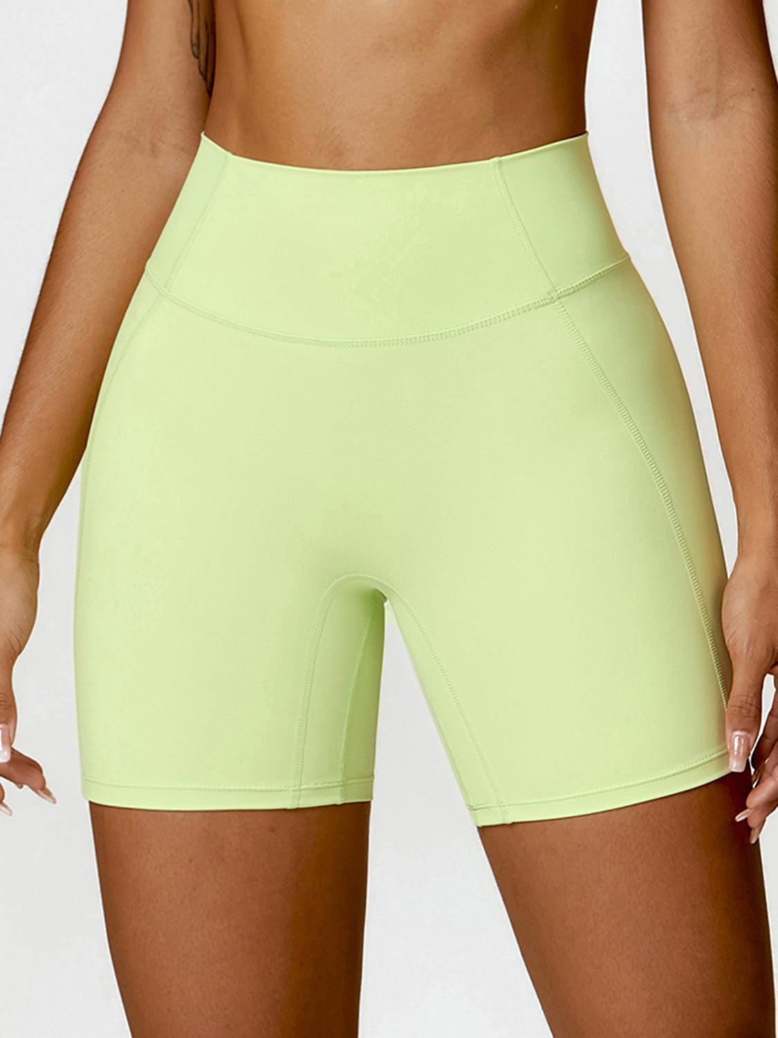 a woman in a neon green short shorts