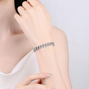 a woman wearing a diamond bracelet