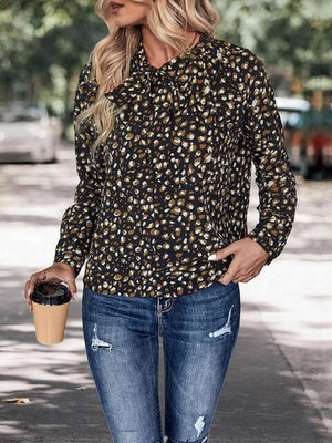 a woman is walking down the street with a cup of coffee