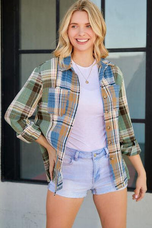 a woman standing in front of a window with her hands on her hips