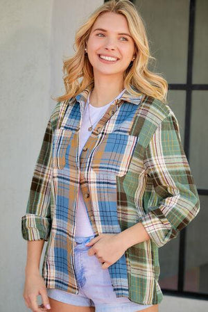 a woman wearing a plaid shirt and shorts