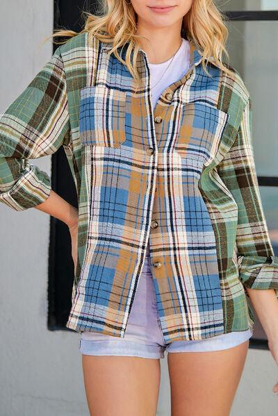 a woman wearing a plaid jacket and shorts