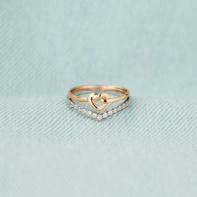 a gold ring with a heart on top of it