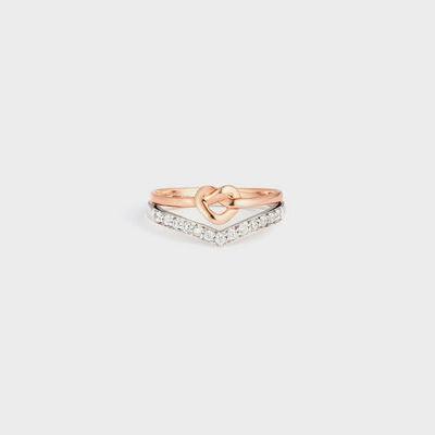 a rose gold ring with a heart on it