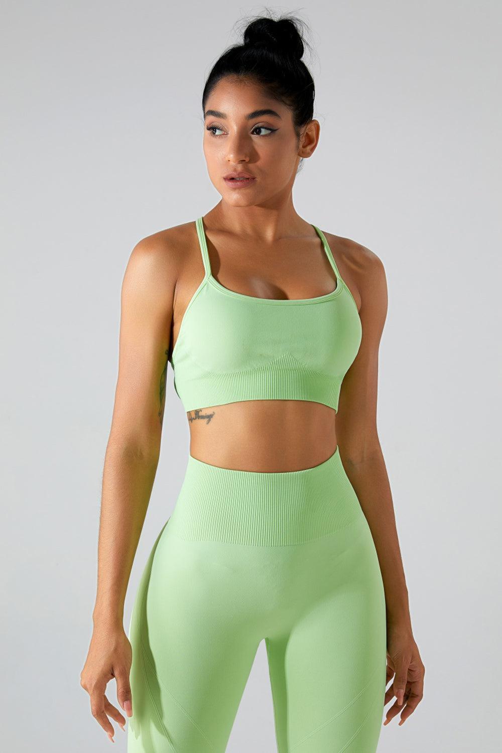 a woman in a green sports bra top and leggings