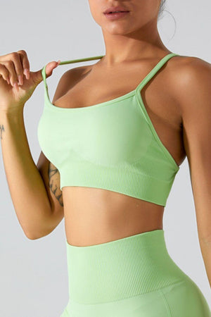 a woman in a green sports bra top