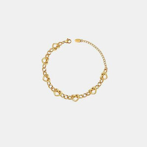 a gold chain bracelet on a white background