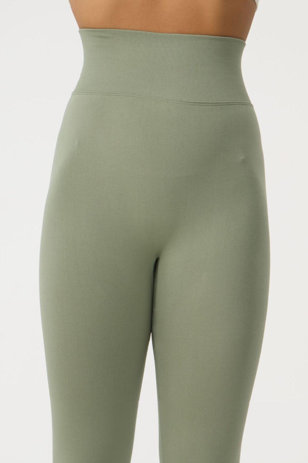 a close up of a woman's butt in a green leggings