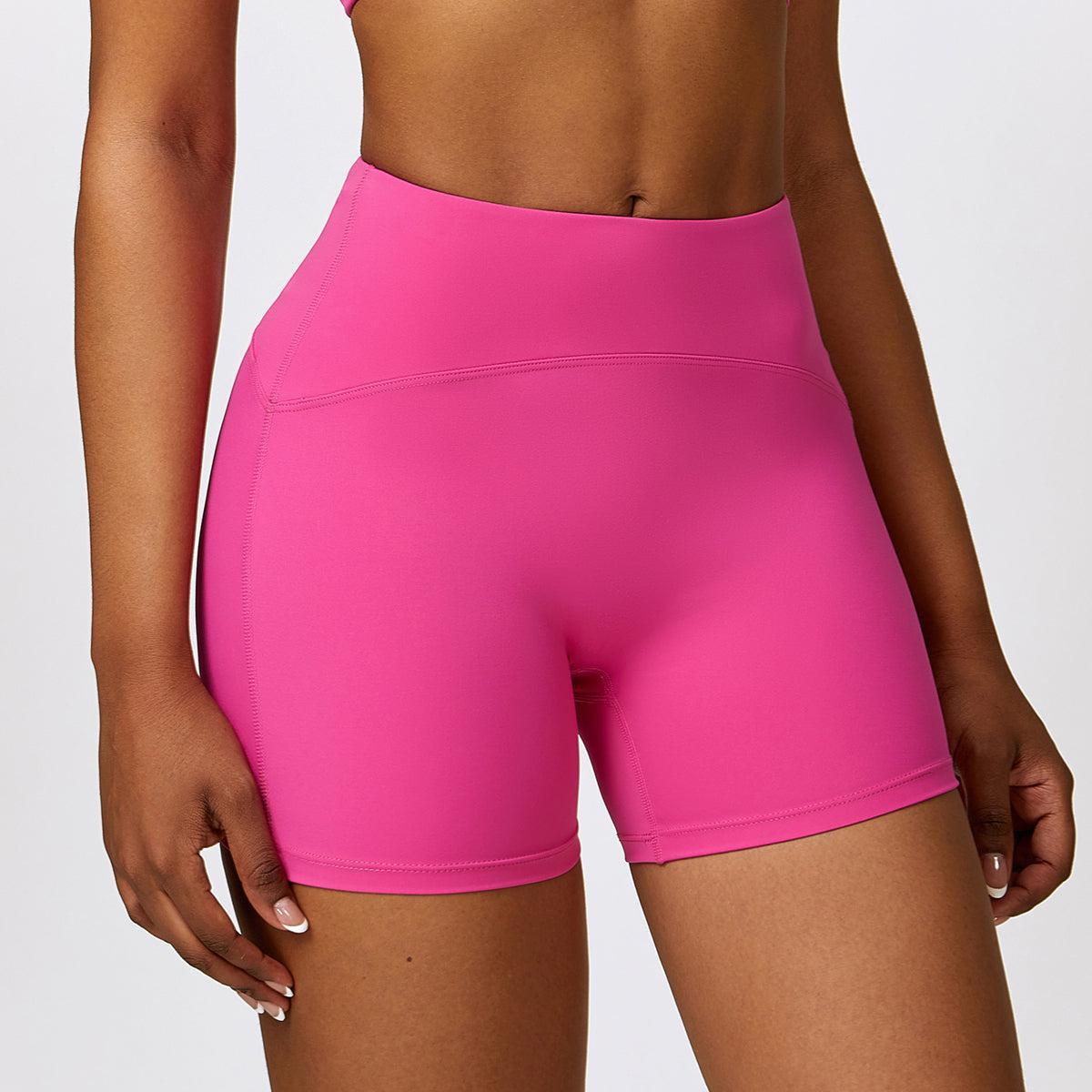a close up of a person wearing a pink shorts