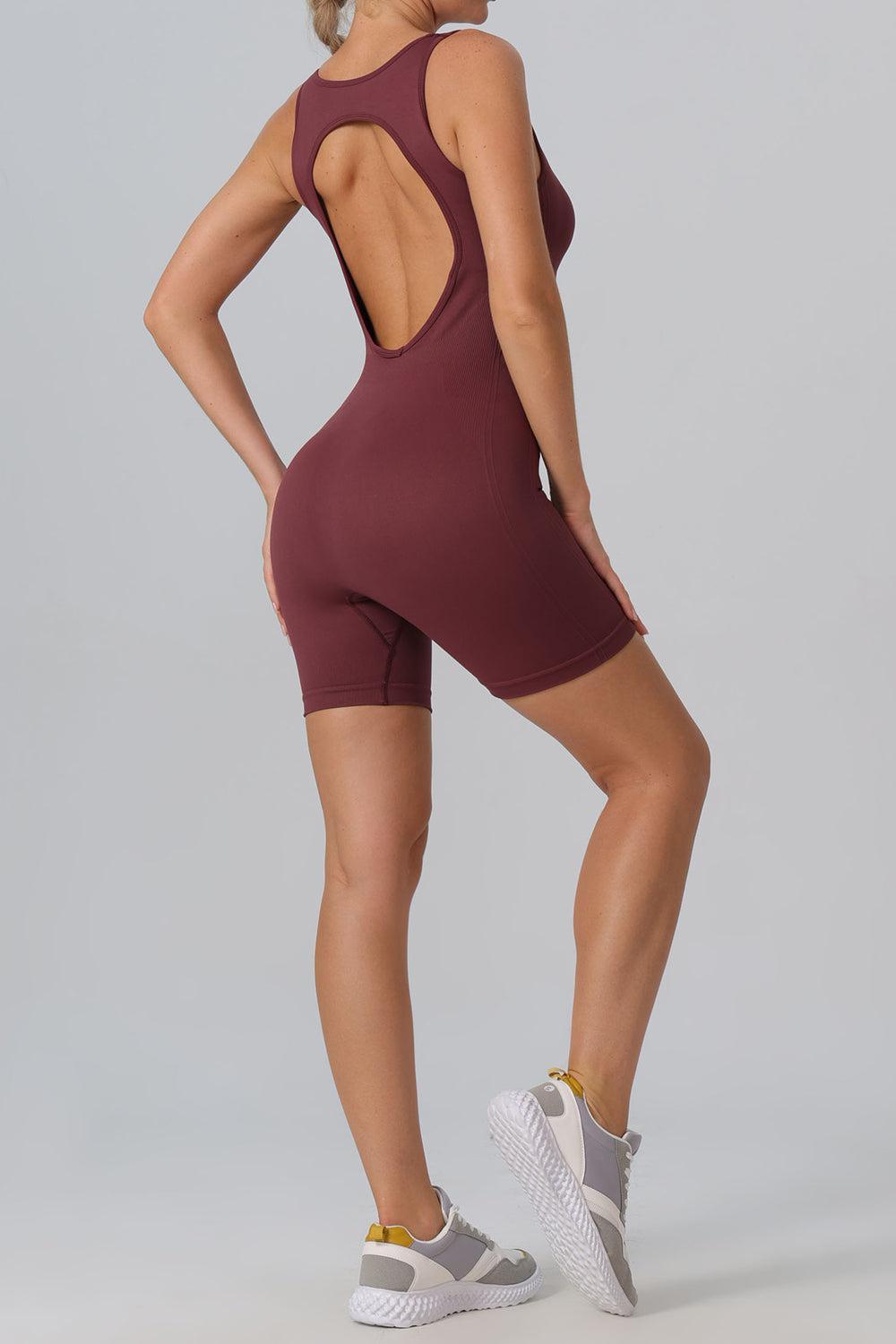a woman in a maroon bodysuit with a back cut out