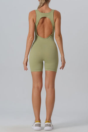 the back of a woman in a green bodysuit