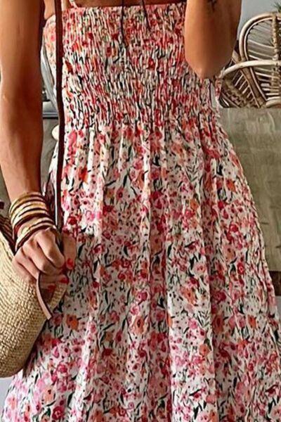 a woman in a floral dress taking a selfie