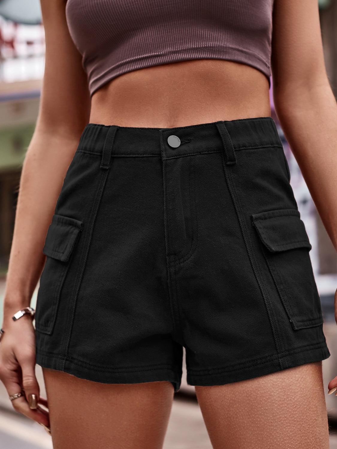a close up of a person wearing black shorts