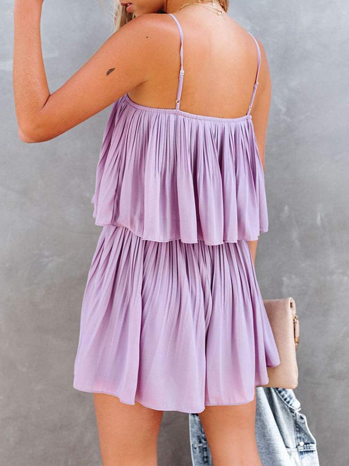 the back of a woman's body wearing a purple dress