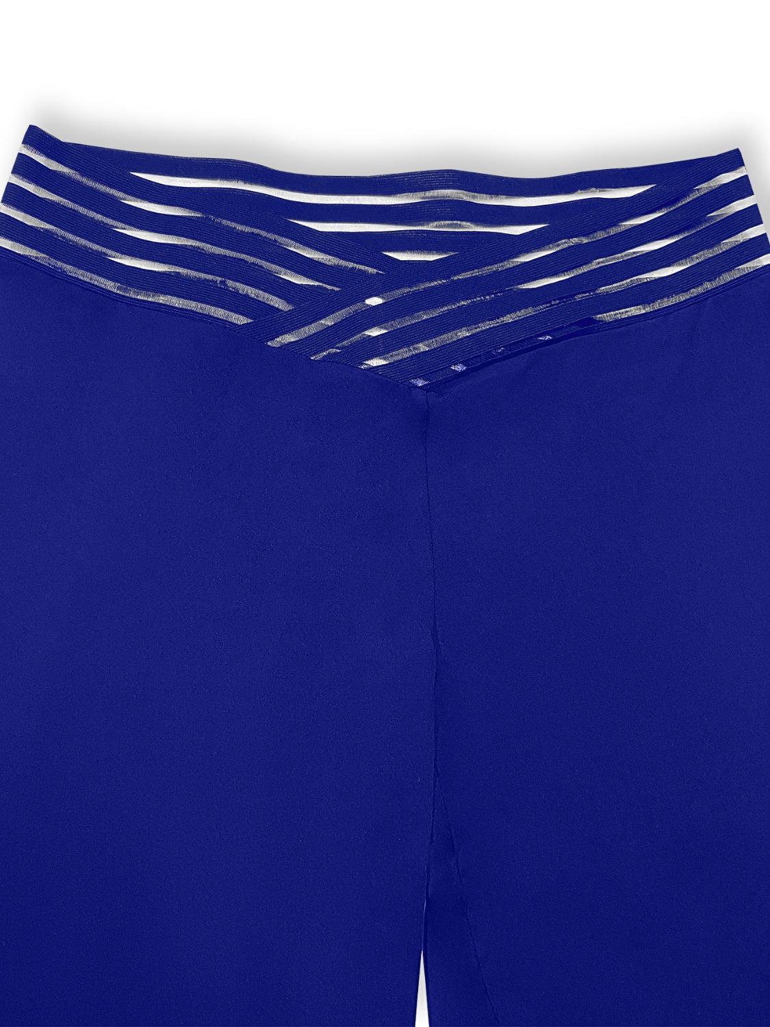 a close up of a blue shorts with silver stripes