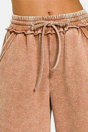 a close up of a person wearing shorts