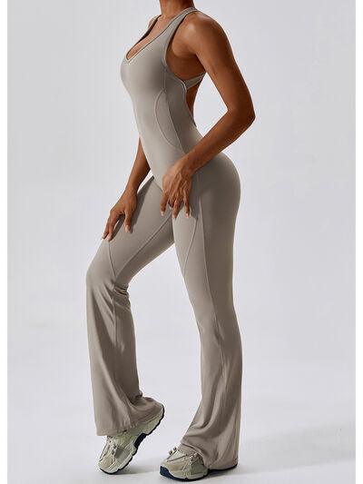 a woman is posing in a yoga suit