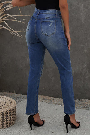 a woman in a black top and blue jeans