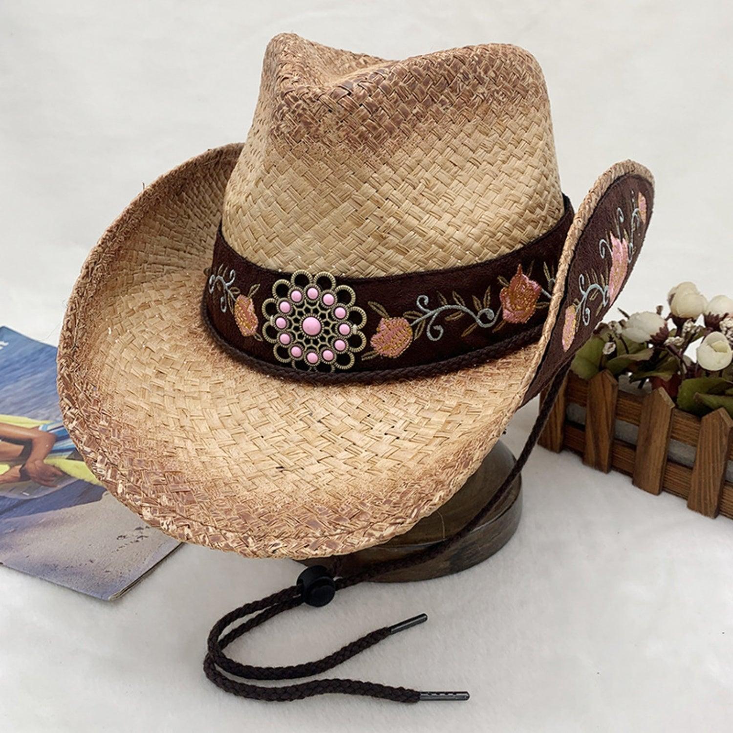 a cowboy hat sitting on top of a wooden stand