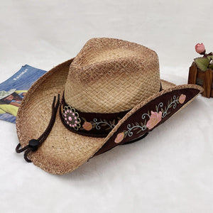 a straw hat with a flower decoration on it