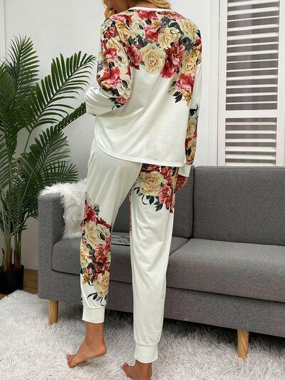a woman wearing a floral print top and pants