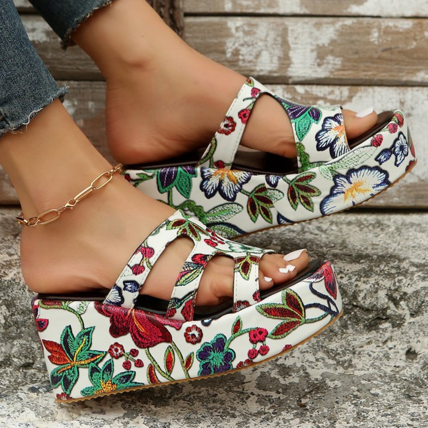 a close up of a person wearing floral shoes