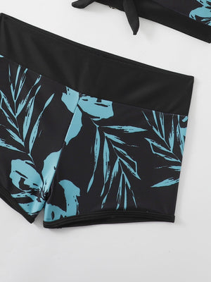 a pair of black and blue floral print swimsuits